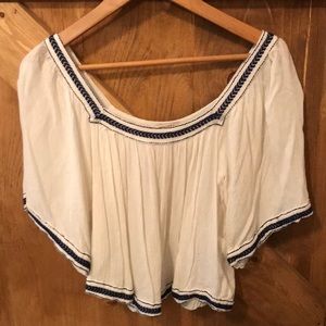 White and navy blue sheer shirt.